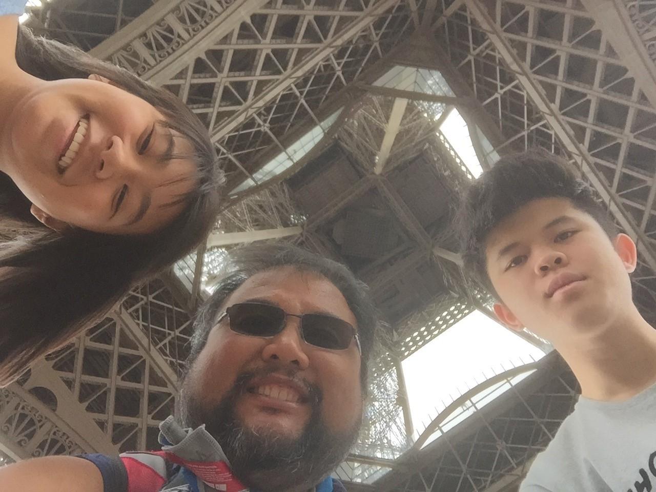 Mr. Padilla and El Camino High students beneath the Eiffel Tower in Paris