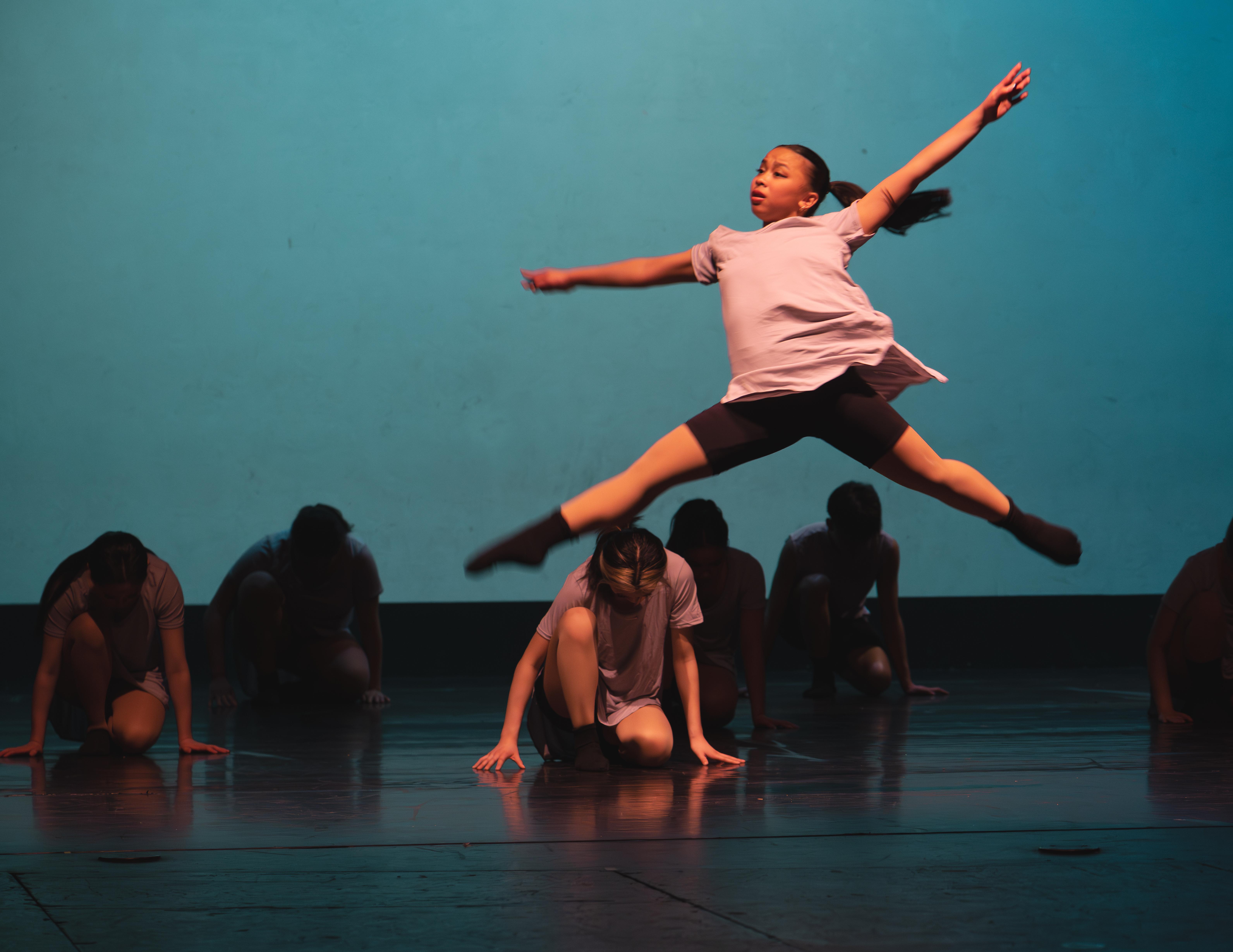 An El Camino High dancer takes a leap during the school's 2023 spring musical.